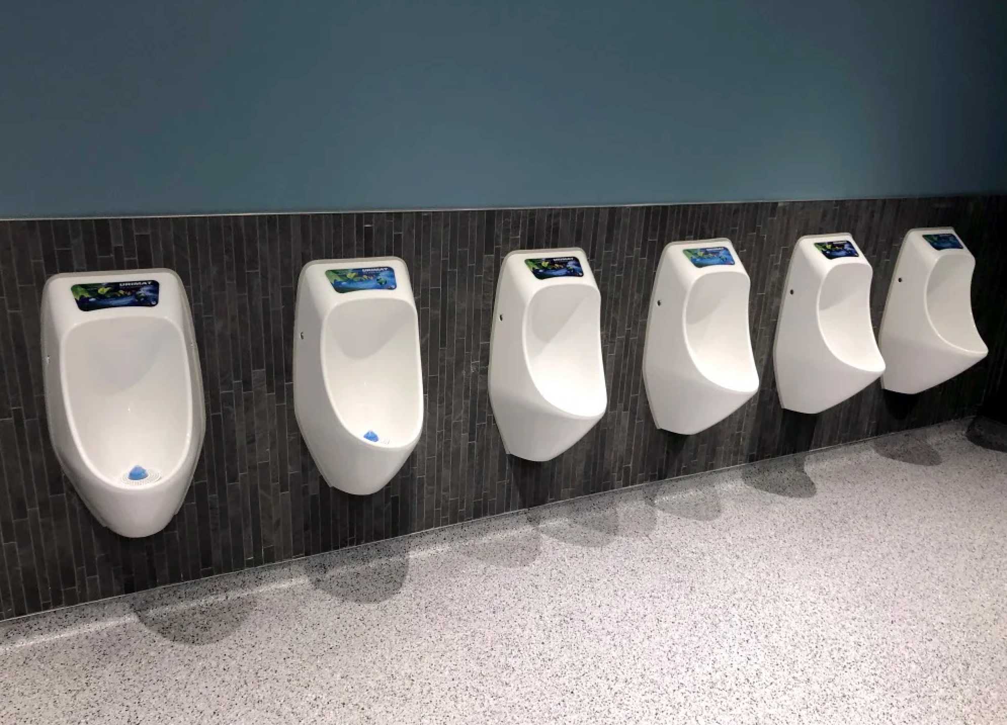 URIMAT waterless urinals installed in a commercial restroom